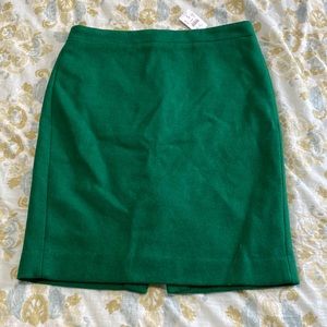 New with tags. Emerald green wool pencil skirt. J. Crew. Size 12.